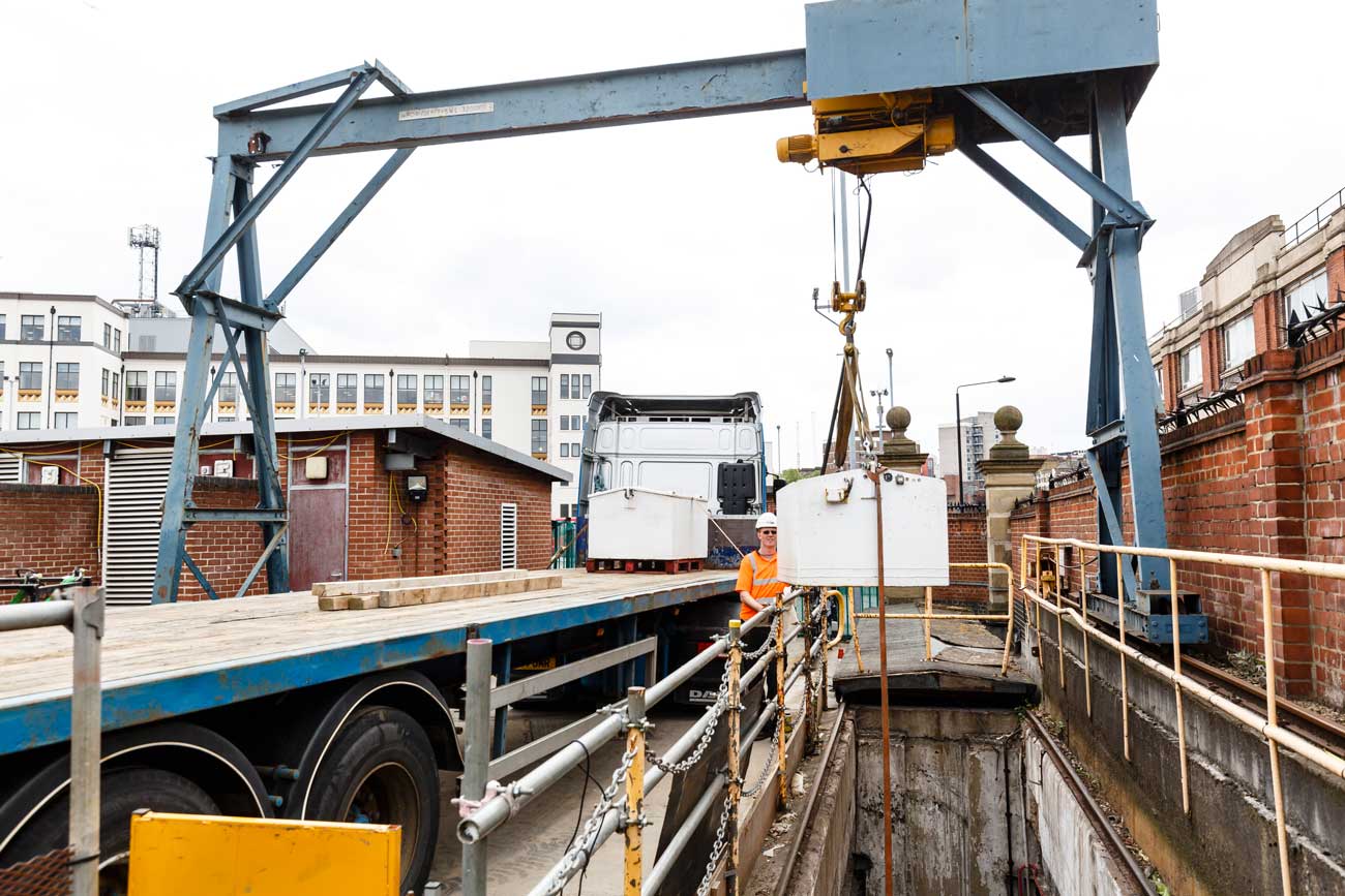 The battery is loaded onto a waiting truck for removal