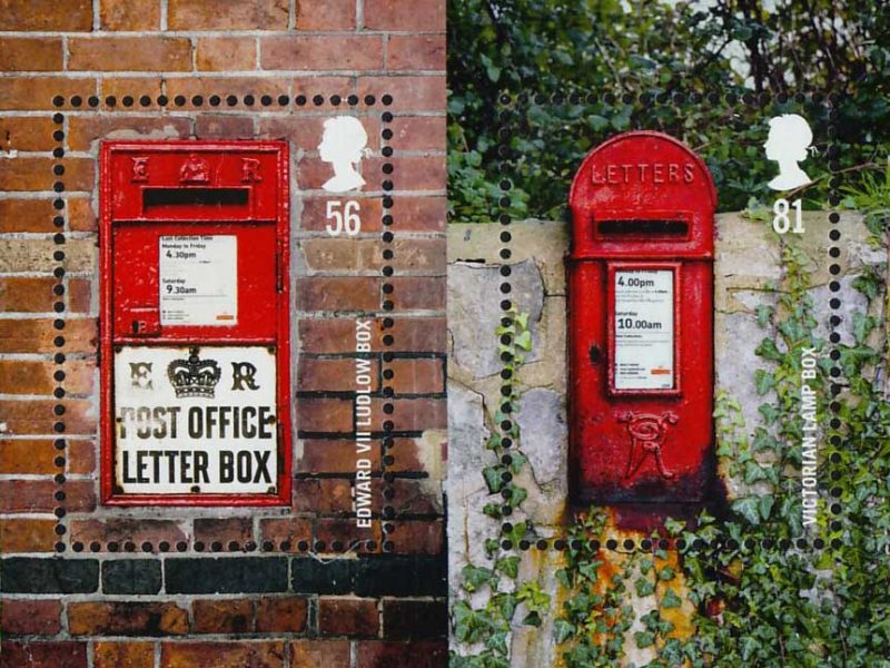 Two stamps showing photos of red wall post boxes.