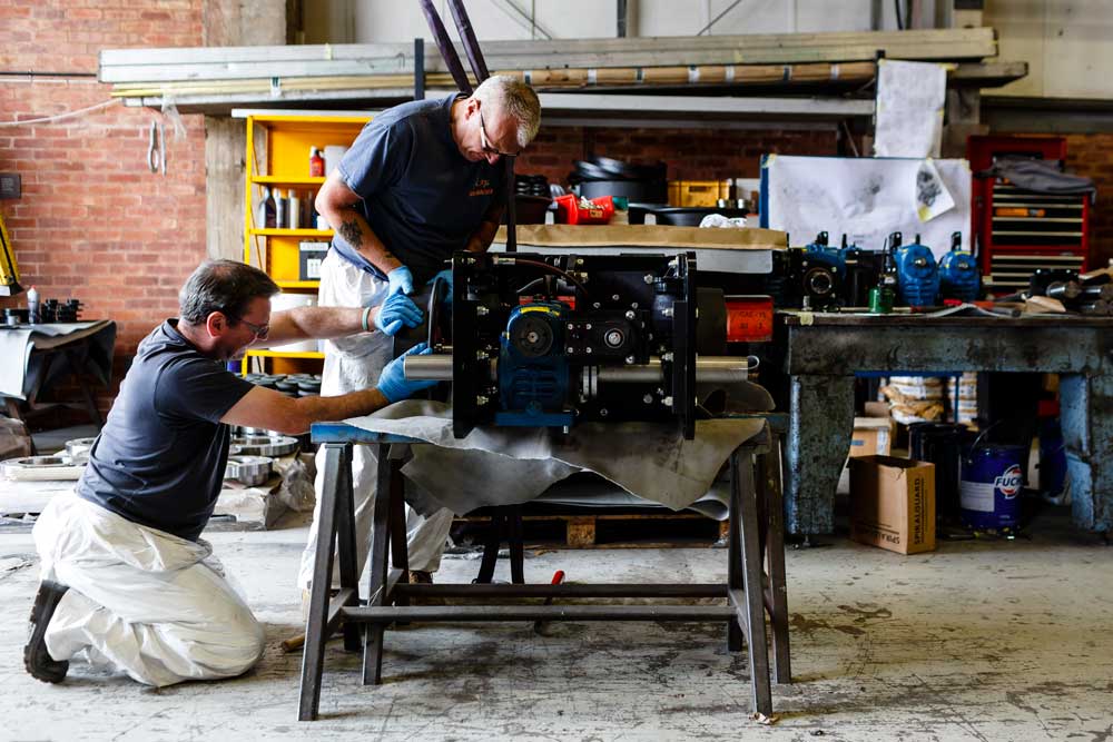 Engineers from Severn Lamb fix wheels onto one of the six engines (Bogie)