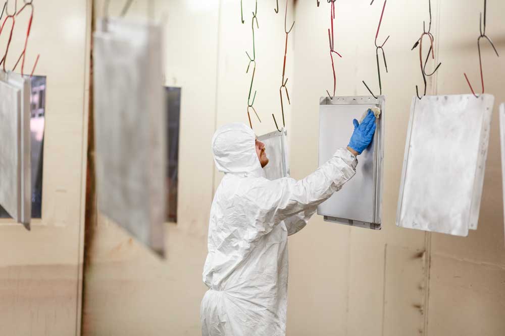 Severn Lamb engineer polishes panels for the Mail Rail carriages