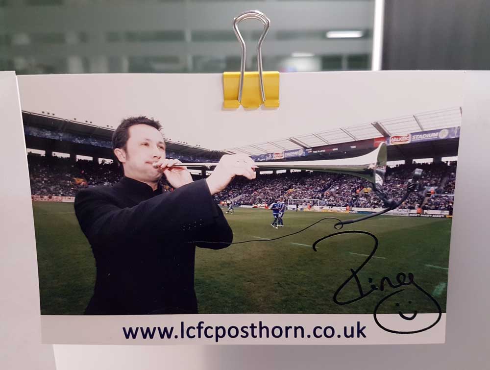 Signed photograph of Paul Hing playing the Post Horn at a Leicester City FC game