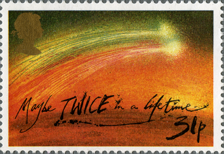 A stamp depicting an image of a comet with the words 'maybe twice in a lifetime' written across it.