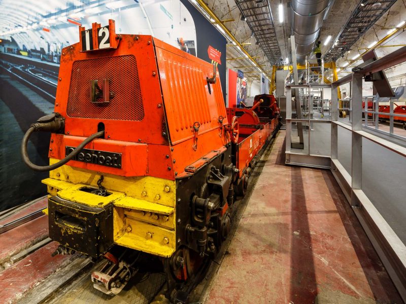 Red and yellow train in Mail Rail exhibition depot