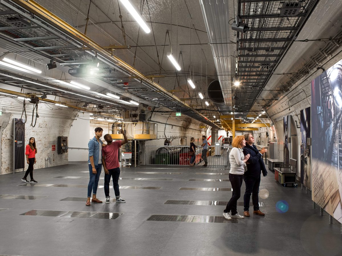 Mail Rail event space featuring five people looking around