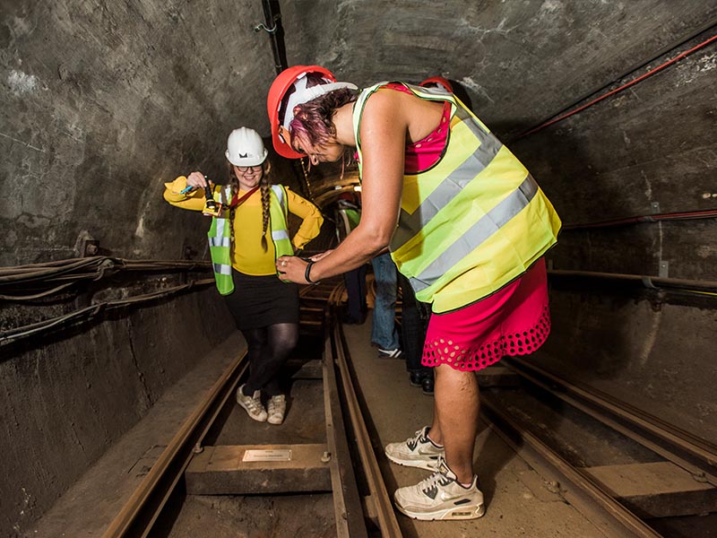 Taking a photo of a plaque on Mail Rail