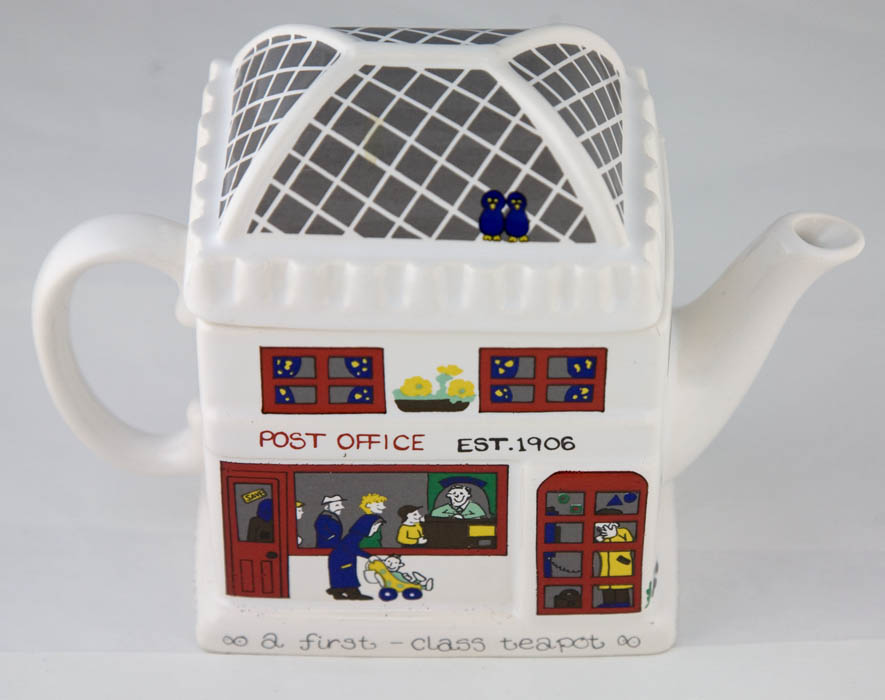 Ceramic teapot decorated to look like a Post Office with customers.