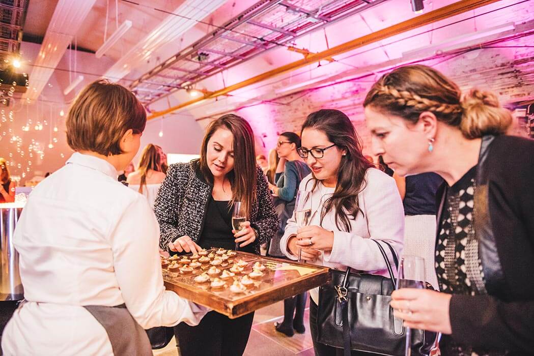 Staff serving food at an event