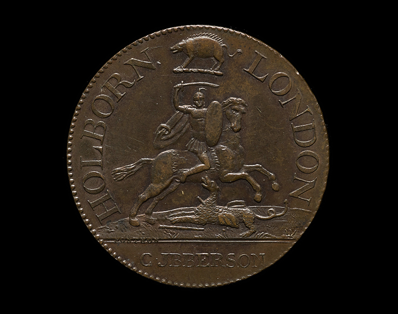 A close up of a coaching inn token. Showing a figure on a horse, with the words 'Holborn' and 'London'