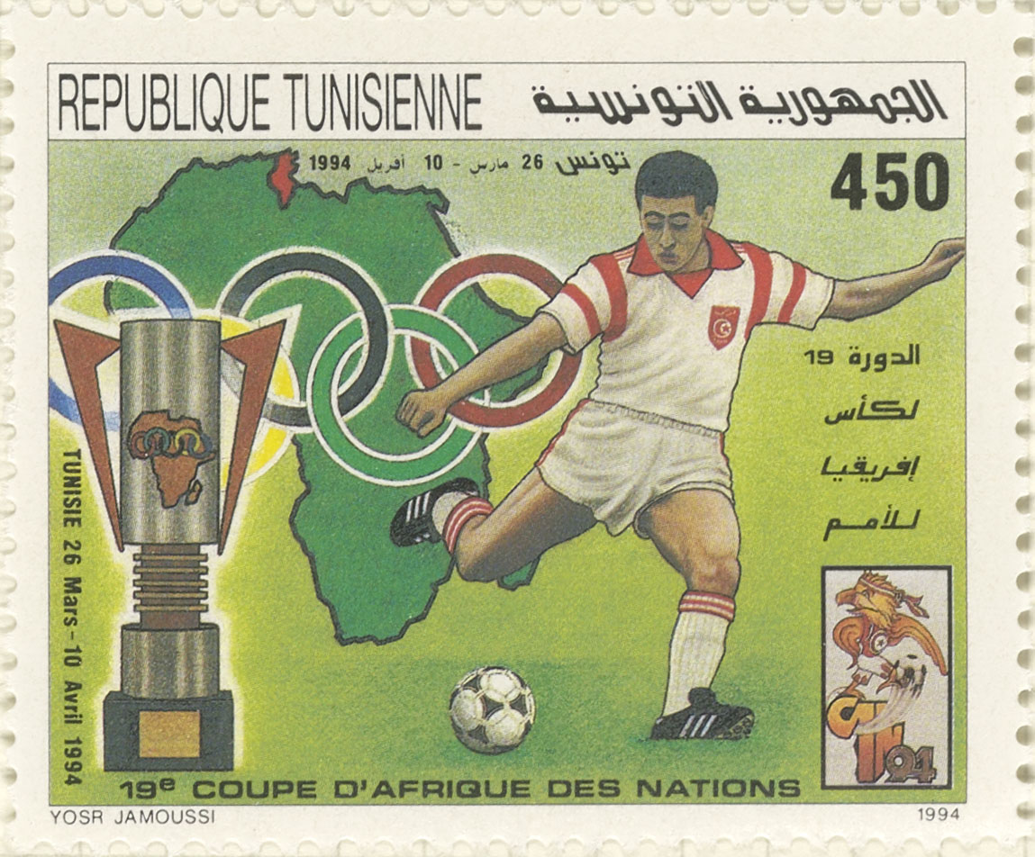 Stamp depicting a football player and a map of Africa.