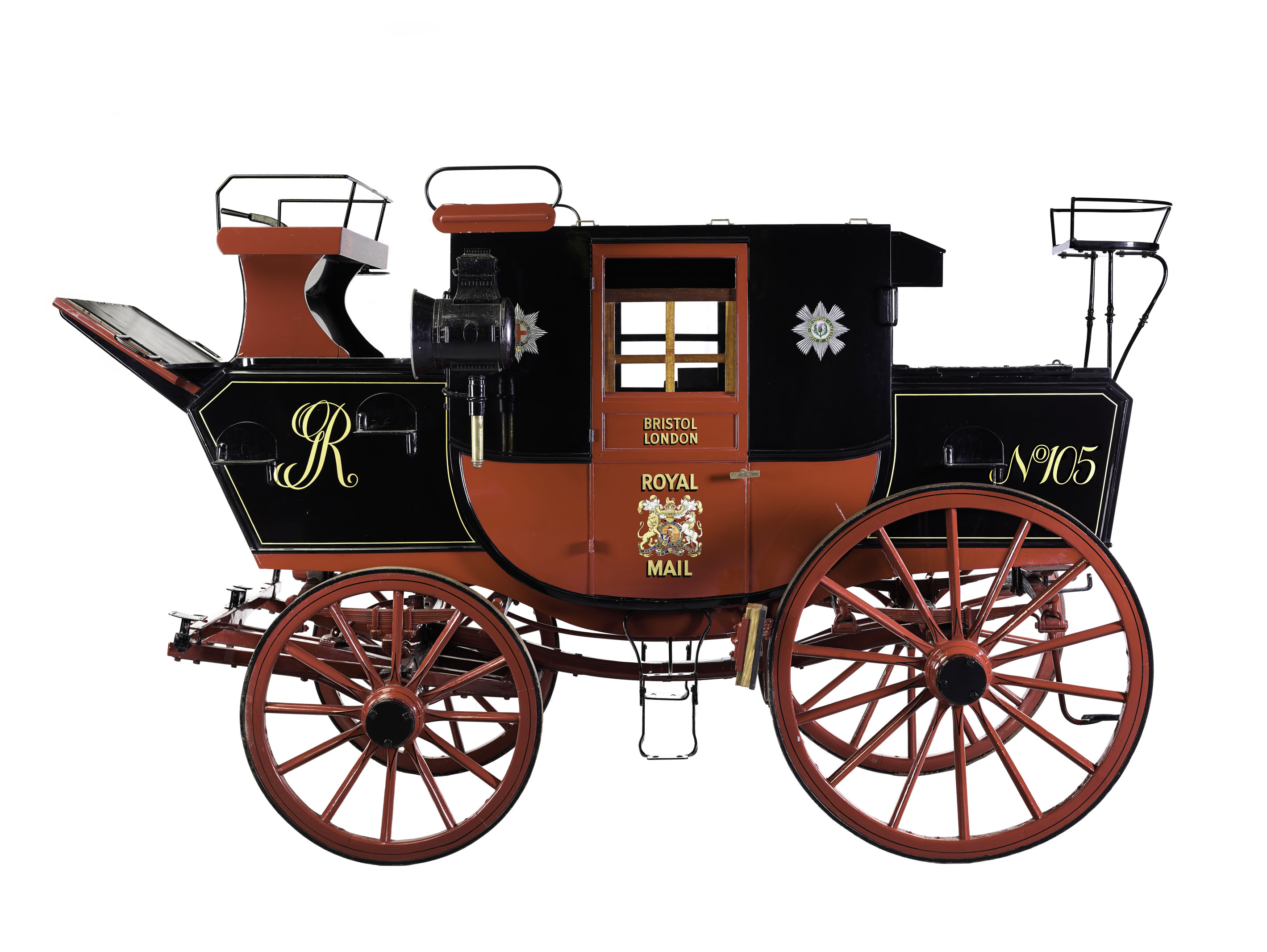 Photograph of the Royal Mail mail coach from c.1800 in red and black.