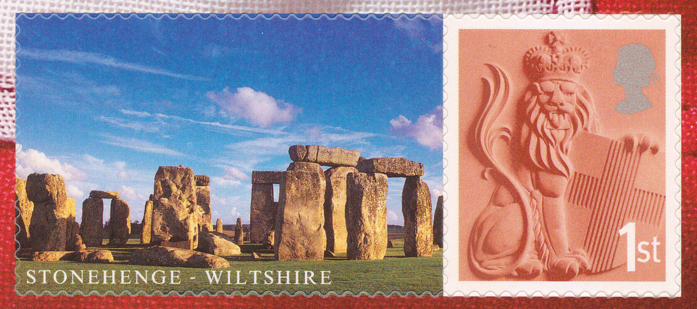 Stamp depicting a lion and a label of Stonehenge.