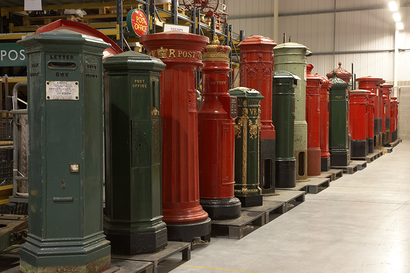 The British Postal Museum Store at Debden, near Loughton, Essex. The line of pillar boxes show the development of post boxes from the earliest trials on the Channel Islands in 1852-3 to the modern day.