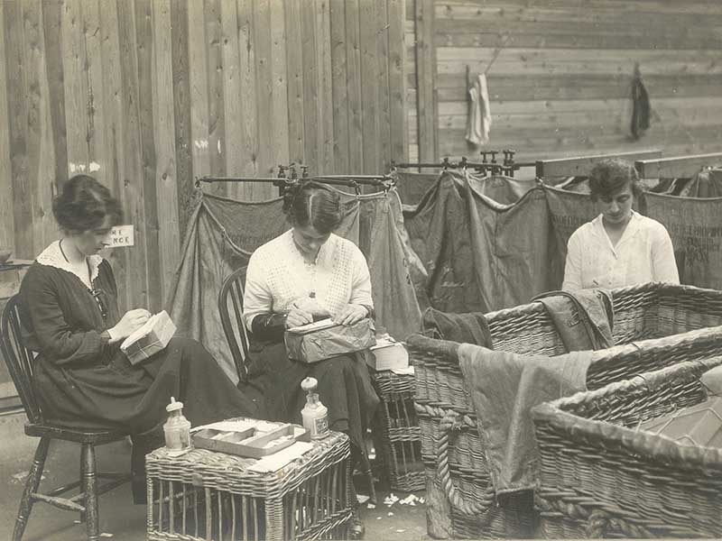 Women mending parcels (POST 56/6)
