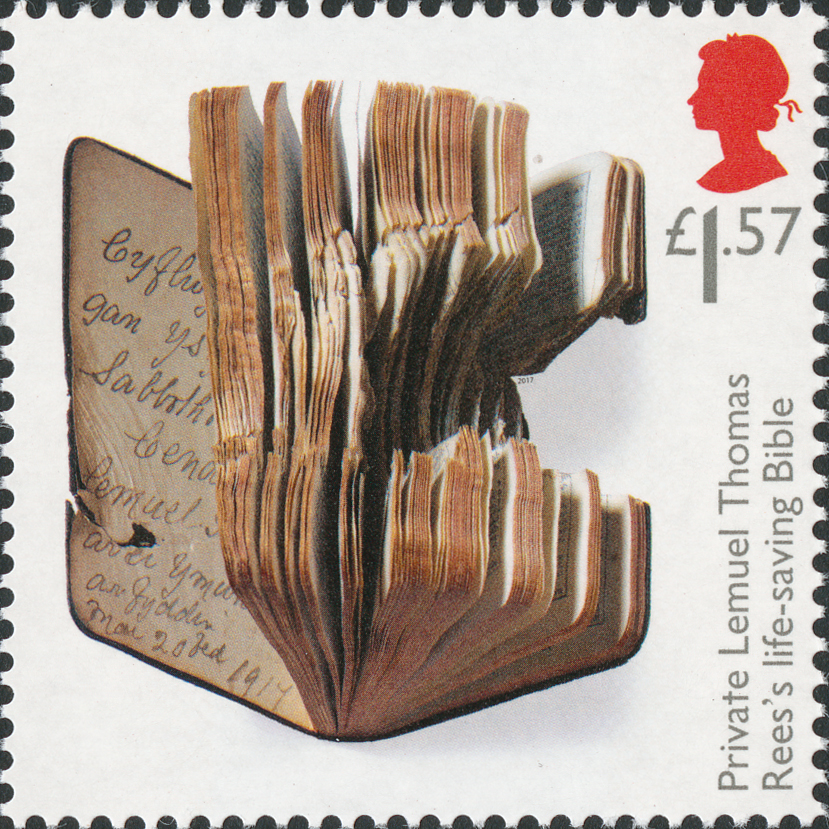 Stamp depicting a bible with a hole blown through it.