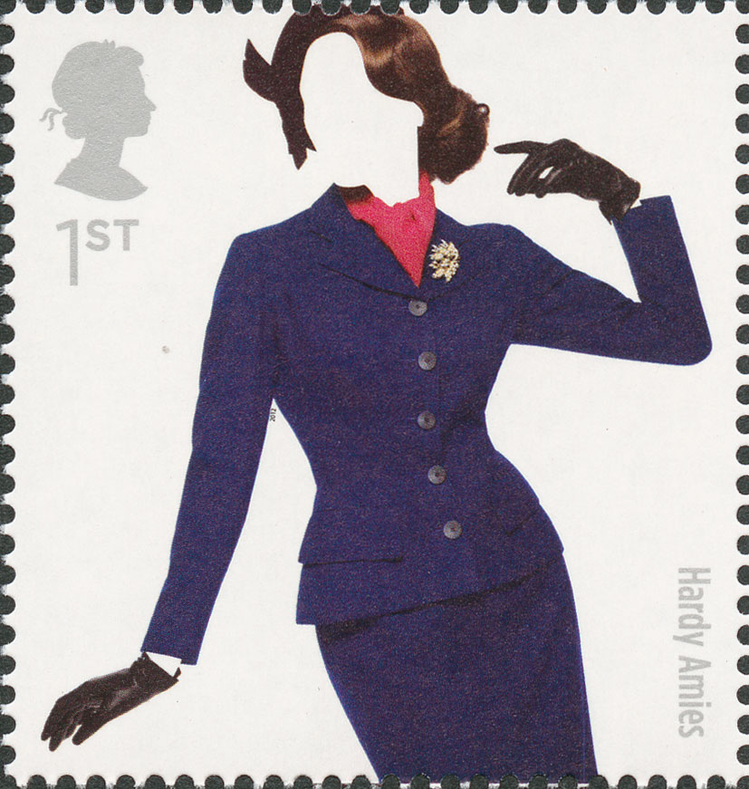 A stamp depicting a model wearing a fitted blue skirt and jacket with brooch.