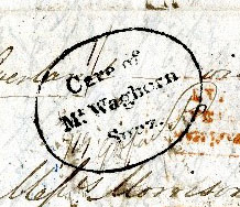 A Closeup of a stamp showing the text 'Care of Mr Waghorn Suez'.
