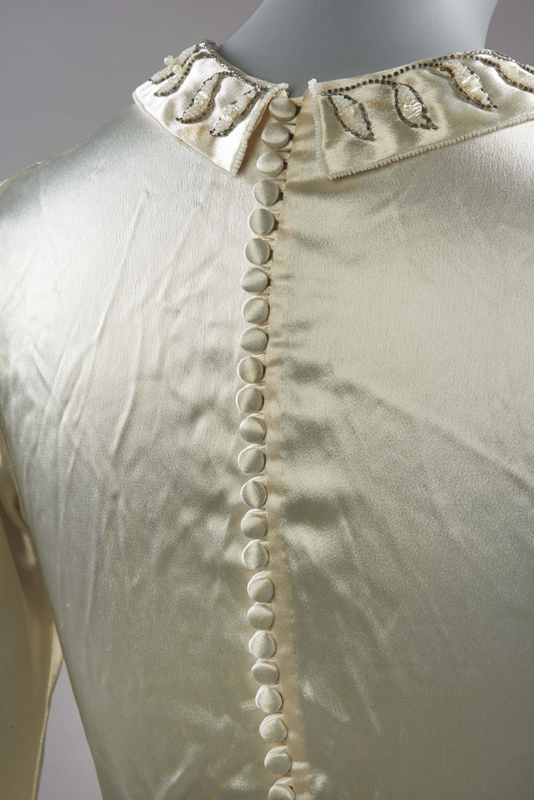 Self-covered buttons at the back of the wedding dress, 1938