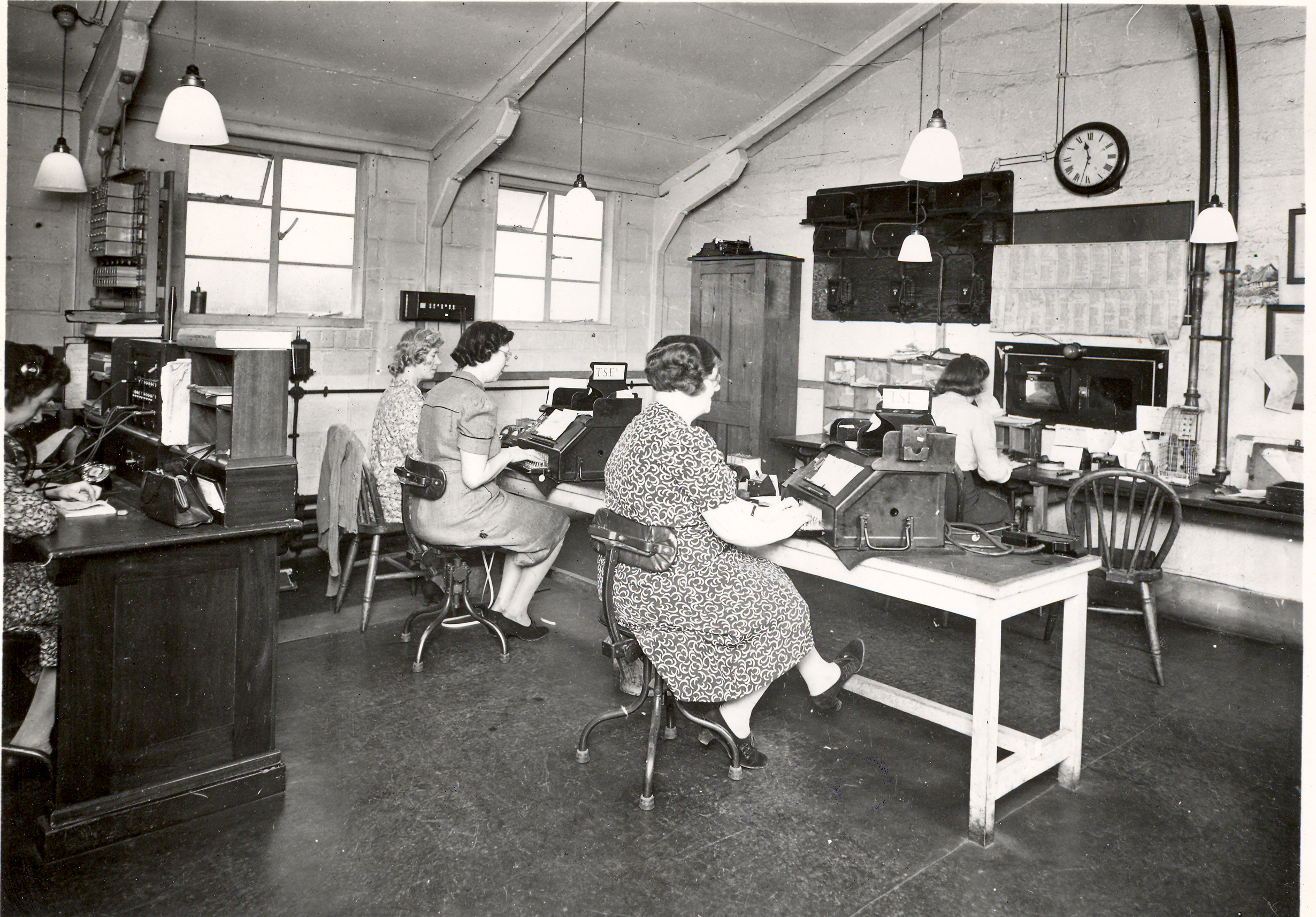 Black and white images of women working at telegraph machines. 