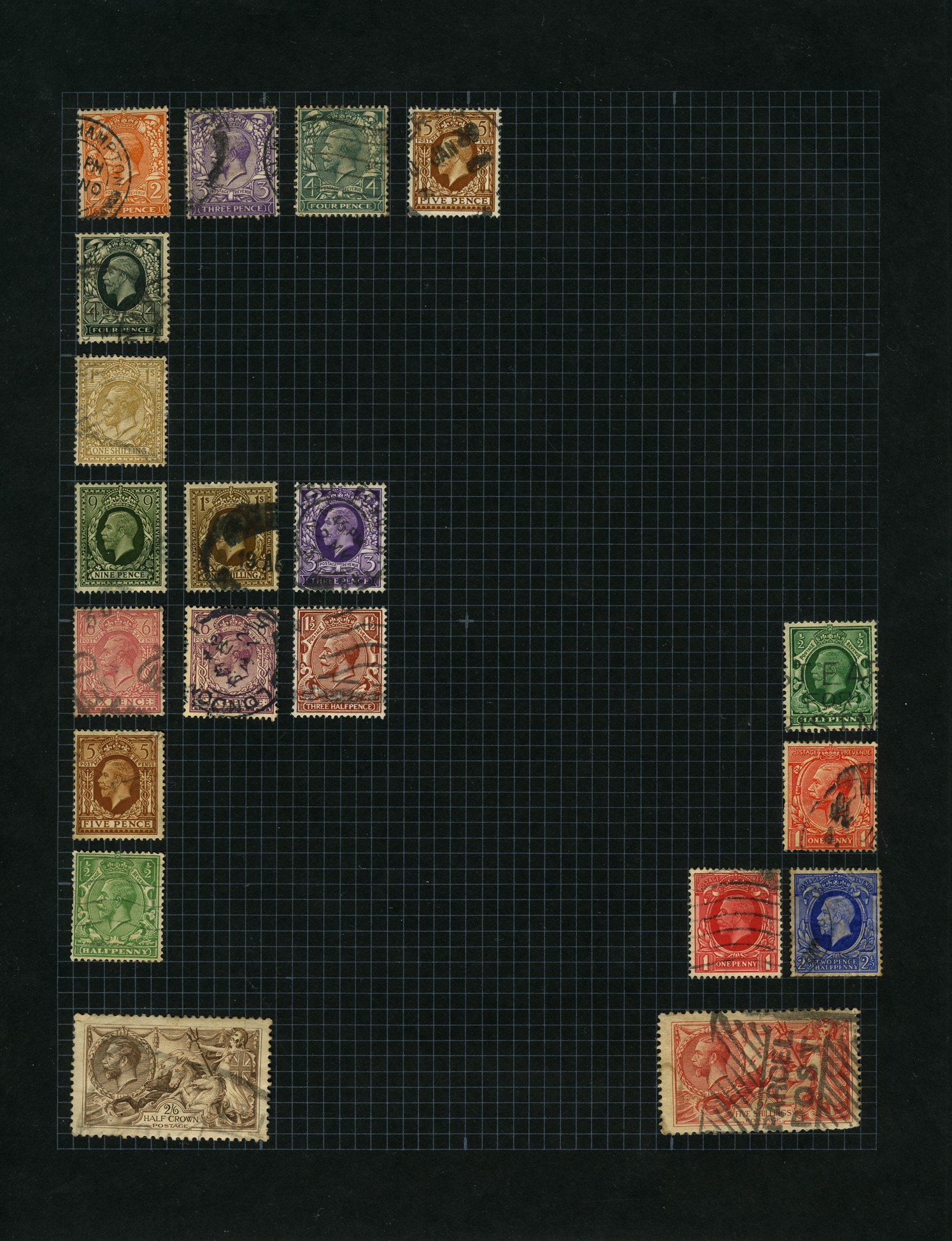 A black album page with mixed coloured stamps affixed in the shape of a letter 'F'.