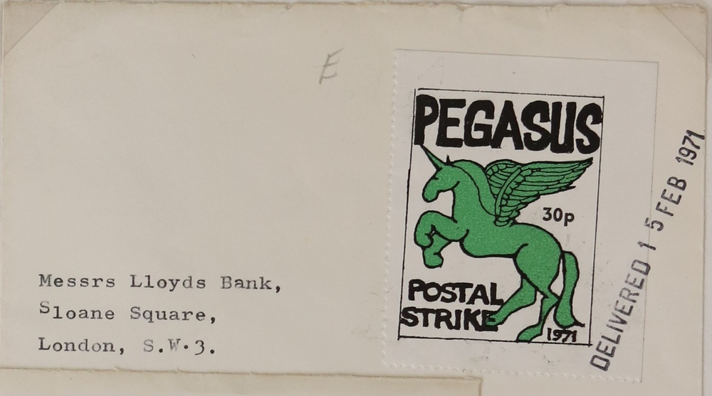 A white envelope with a label in the top right-hand corner. The label has a green winged horse standing on its back legs. Text reads ‘Pegasus. 30p. Postal Strike. 1971’. The envelope is addressed to ‘Messrs Lloyds Bank. Sloane Square. London. SW3’. It has been marked ‘Delivered 15 Feb 1971.