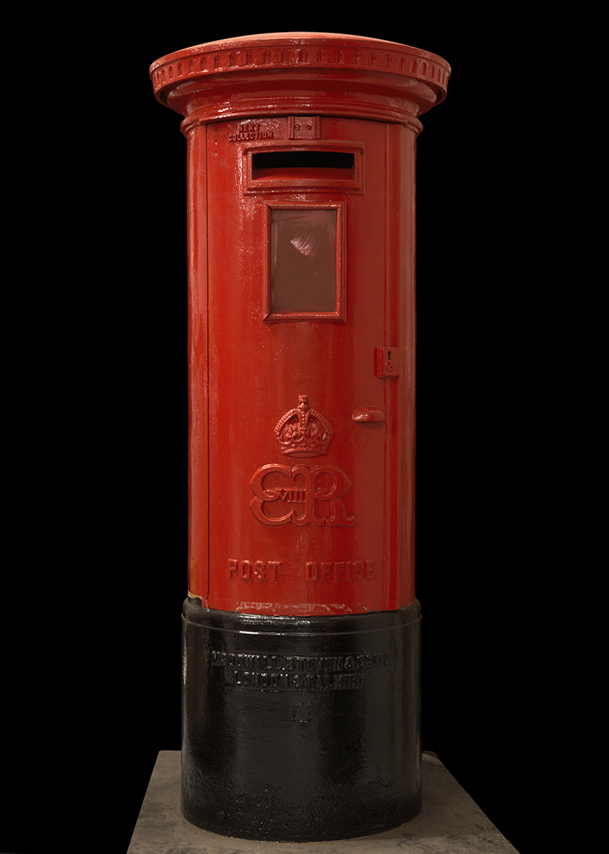 A red pillar box viewed from the front. A crown cypher with the letters 'ER VIII' decorate the area below the letter slot.