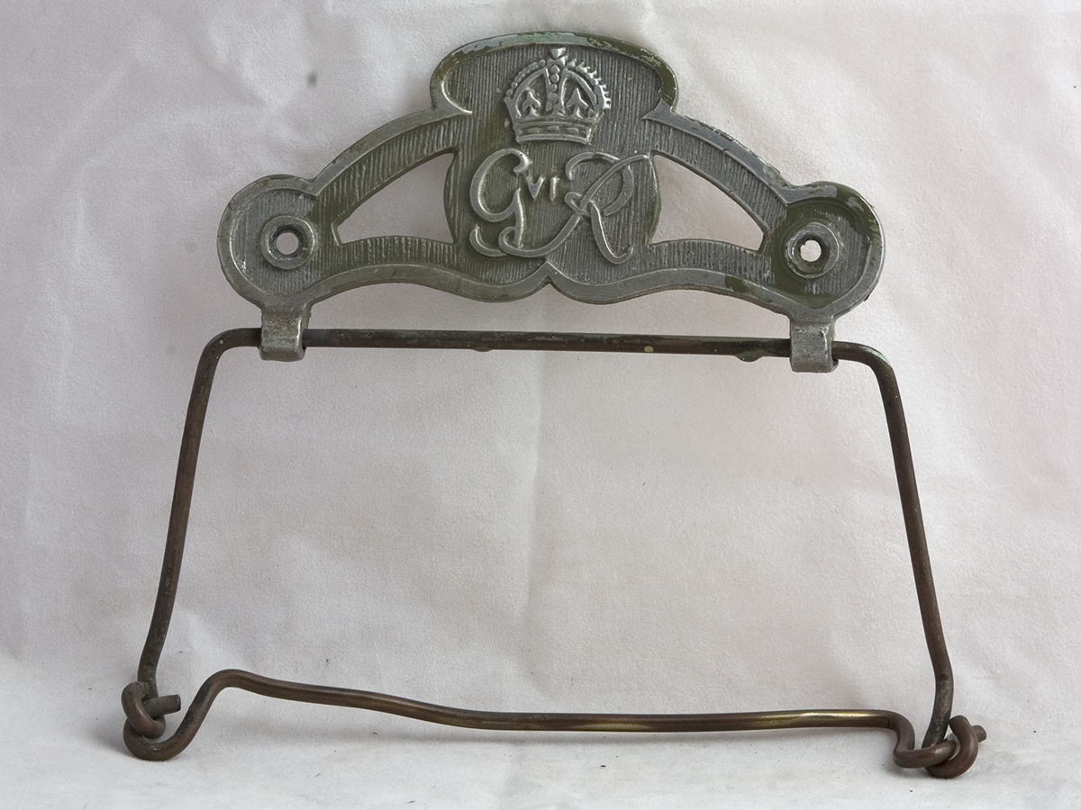 Photo of a metal Toilet Roll Holder with George VI cypher.