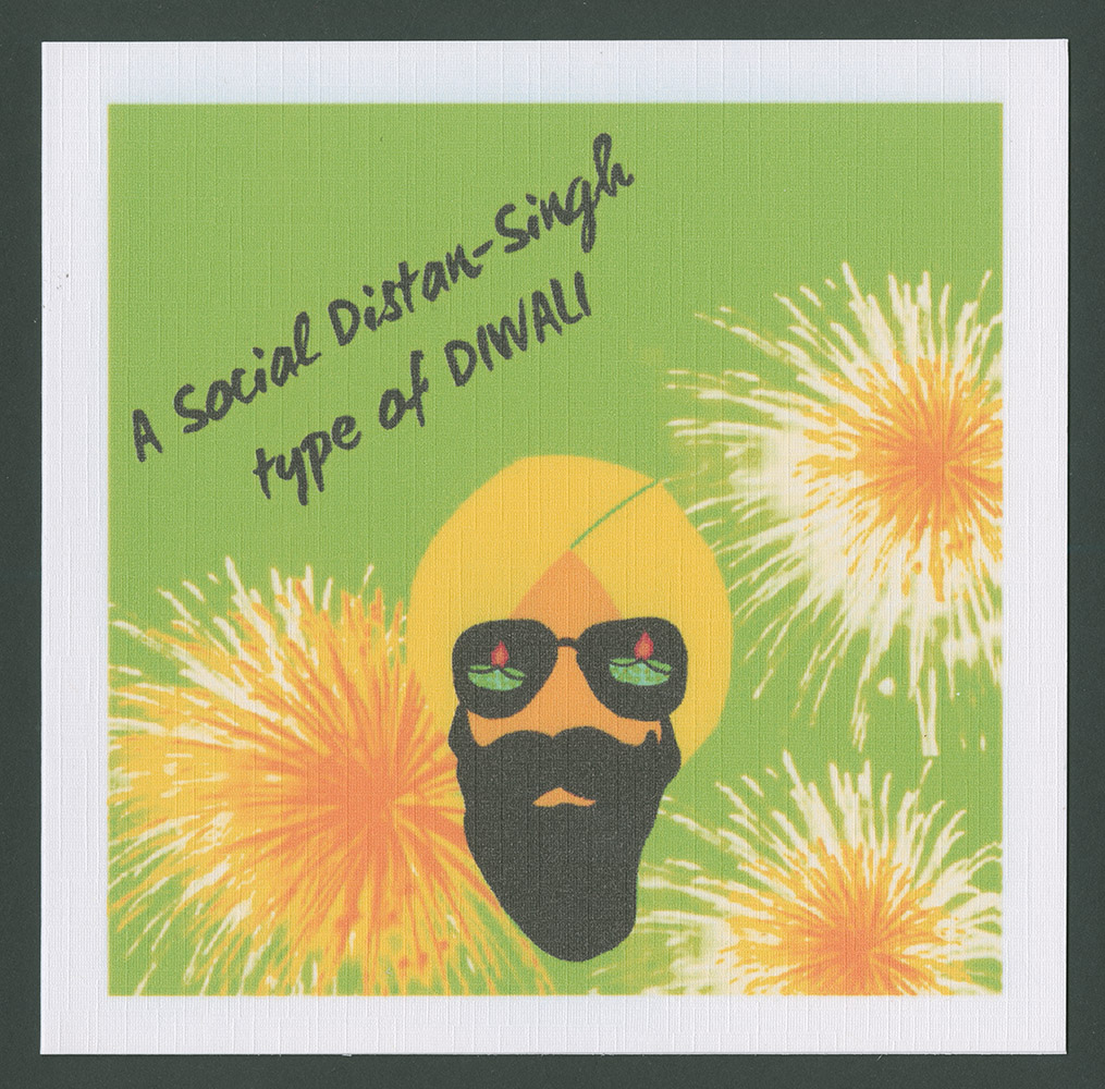 Diwali card designed by The Card Wala Co. On the front of the card is printed 'A Social Distan-Singh / type of DIWALI'. The front of the card features a green background, against which three illustrated yellow and orange fireworks are exploding. In the bottom centre of the design is an illustrated face of an Asian man with a beard wearing a yellow turban. He is wearing sunglasses, in which are reflected two small oil lamps.