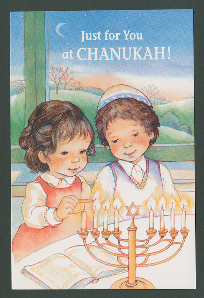 Hannukkah card depicting two Jewish children sitting at a table. The girl is lighting eight candles in a Menorah, which is decorated with the star of David in the centre. In the background of the scene are hills, trees and a moon. Message on the front reads: 'Just for you at Chanukah!'.