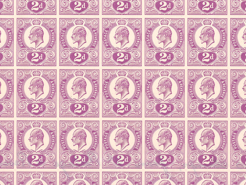 A closeup of a sheet of purple stamps.