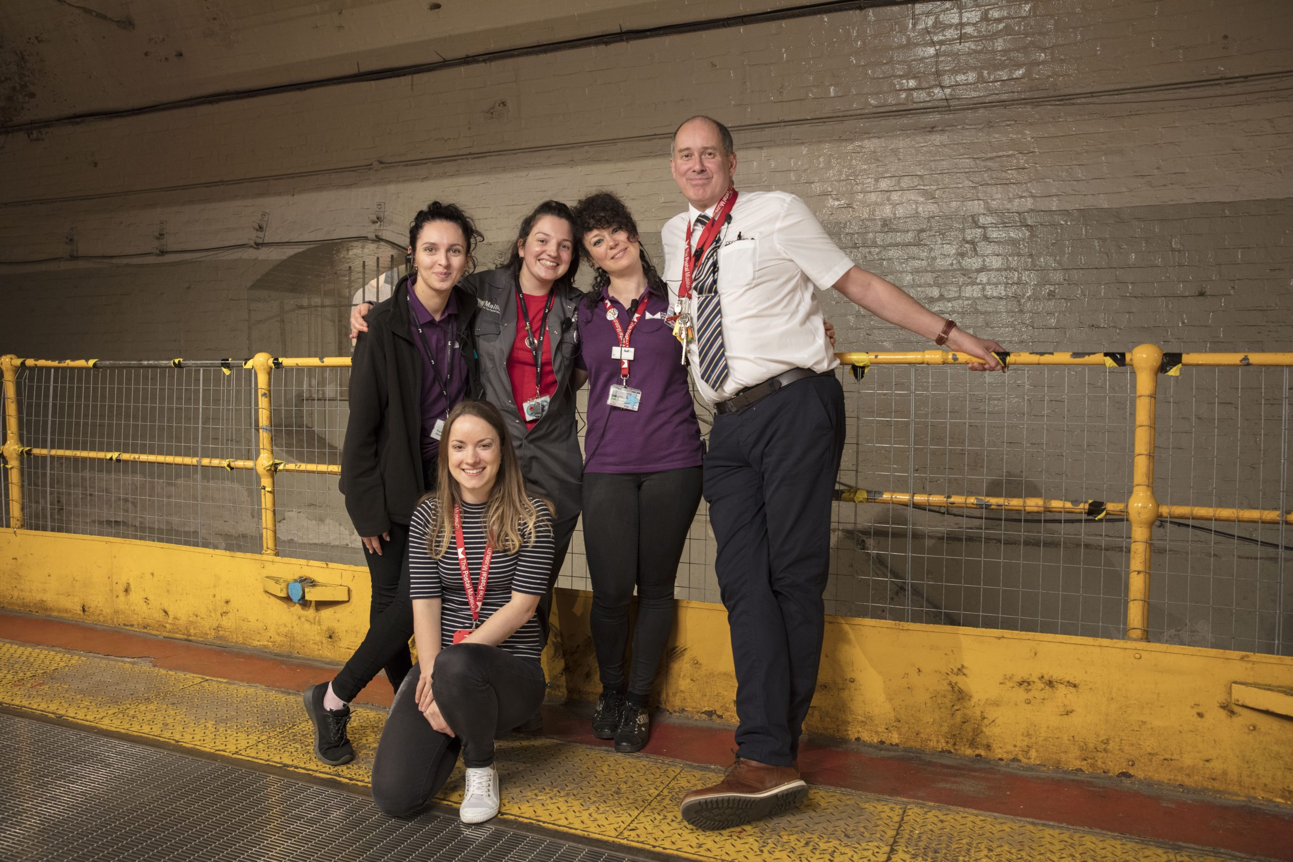 Five members from our Visitor Experience team posing for a photograph