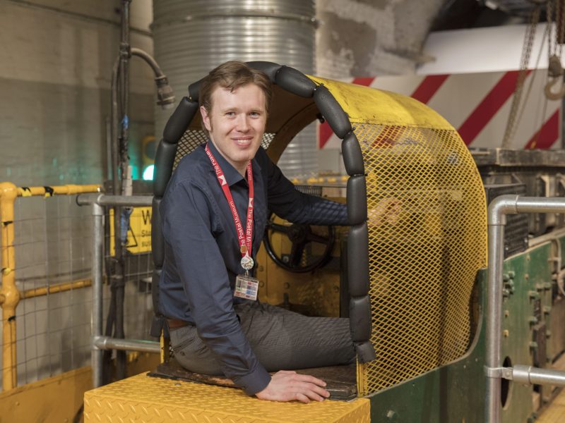 One of our Mail Rail train drivers sat in the drivers carriage