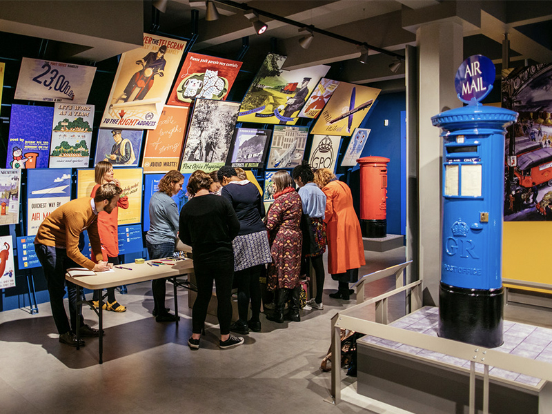 A group of people attend a tour at the museum