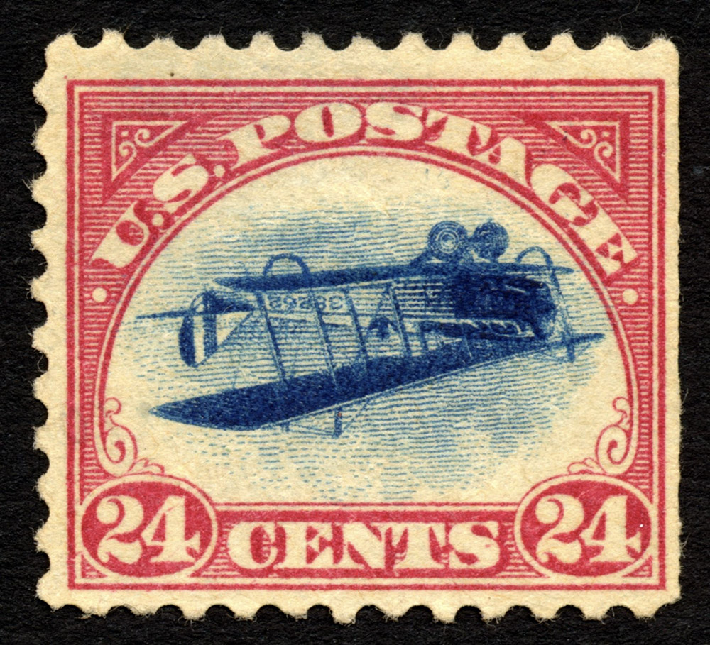 A postage stamp printed in red and blue ink, with an illustration of a flying plane in the centre, and the words 'U.S. Postage 24 cents' around this.