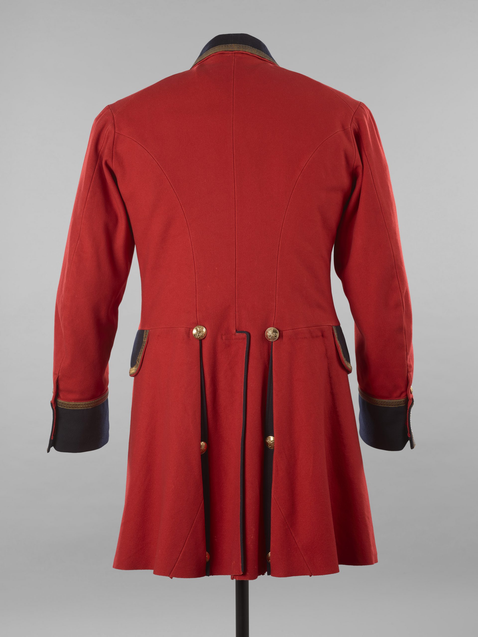 The back of red frockcoat, moth damaged located at the bottom of it