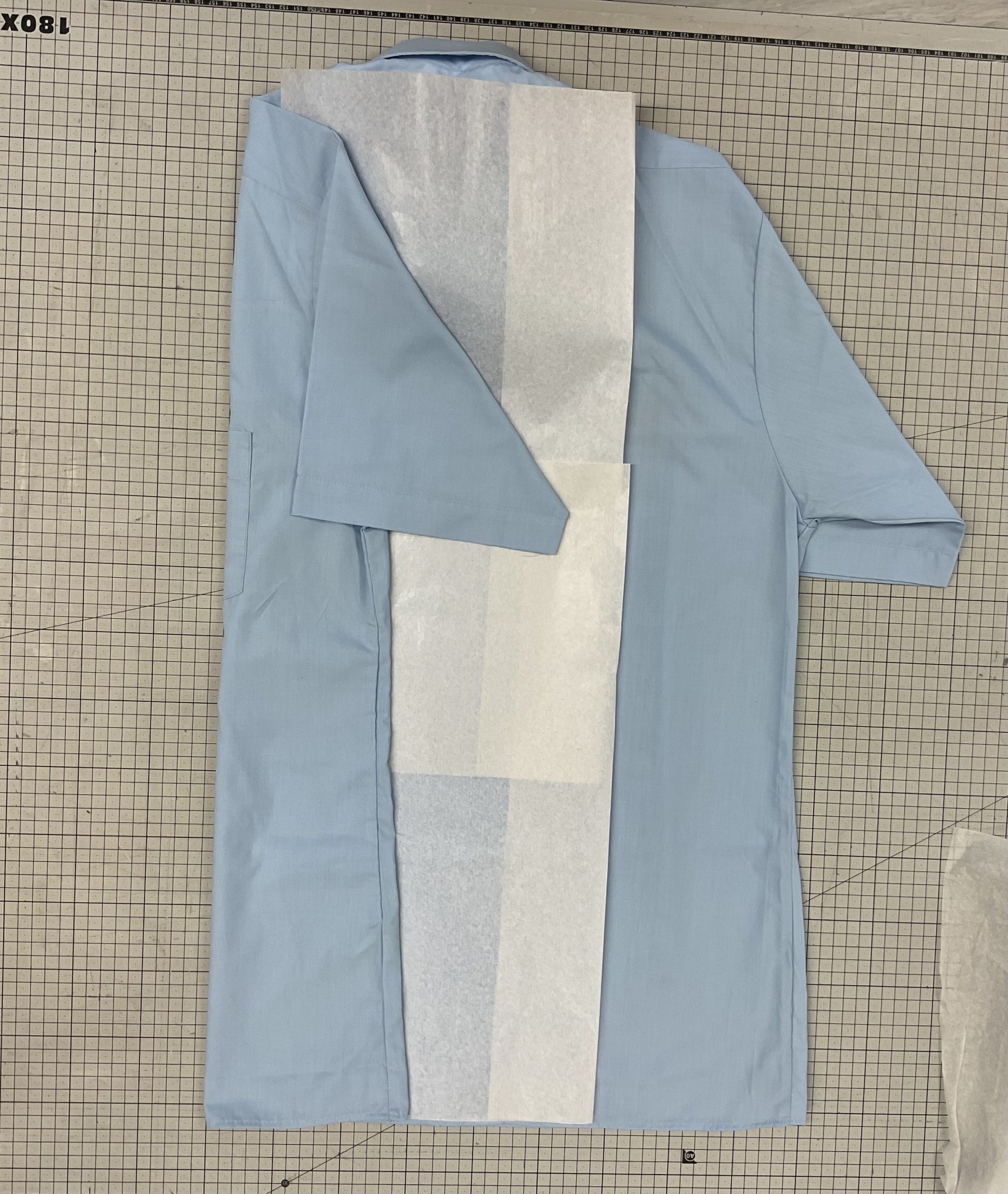 A shirt being fold on a table
