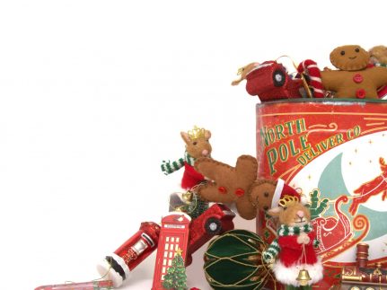 Arrangement of green, red and gold christmas decorations