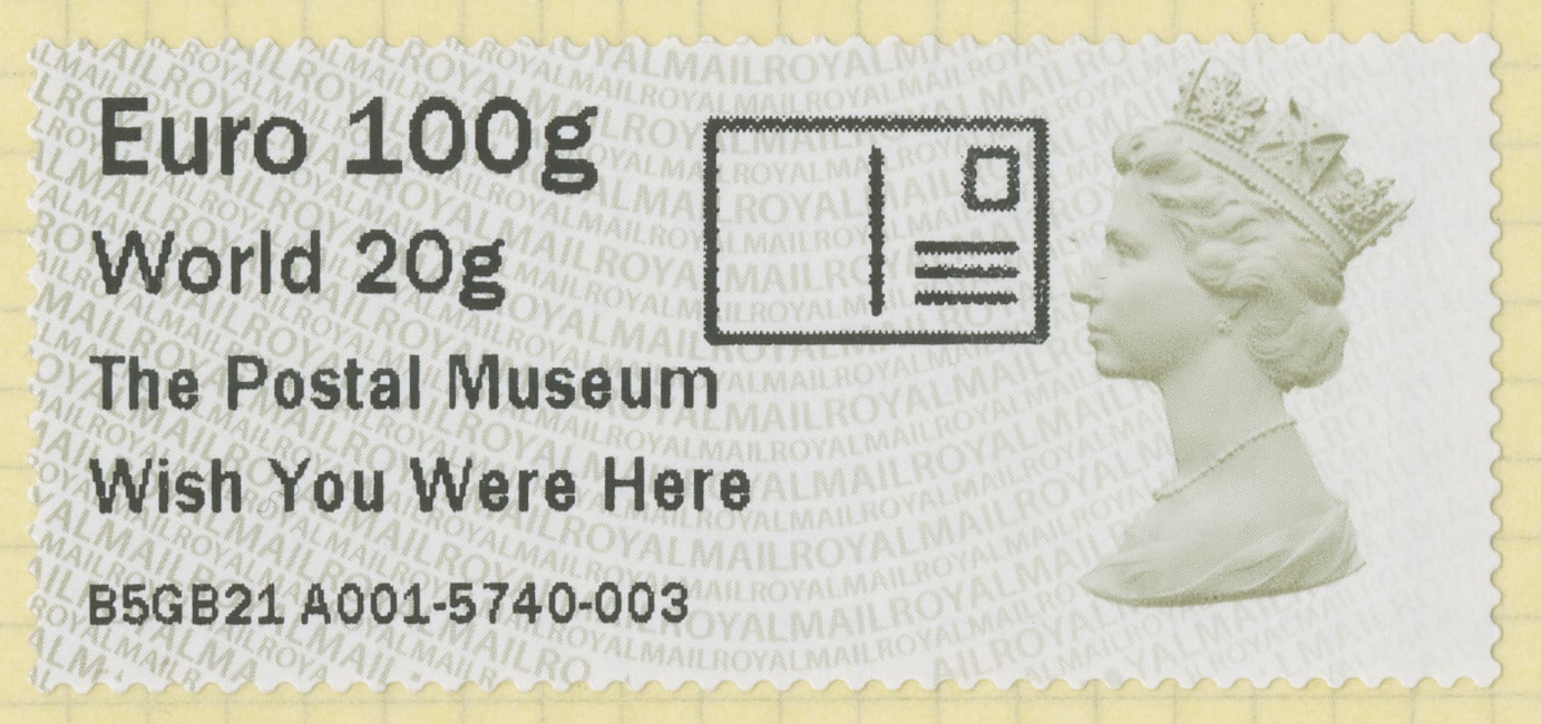 An international stamp with text to the left and a yellow Queen Elizabeth II profile to the right. The text reads: Euro 100g, World 20g, The Postal Musuem, Wish You Were Here. At the bottom, a reference number.