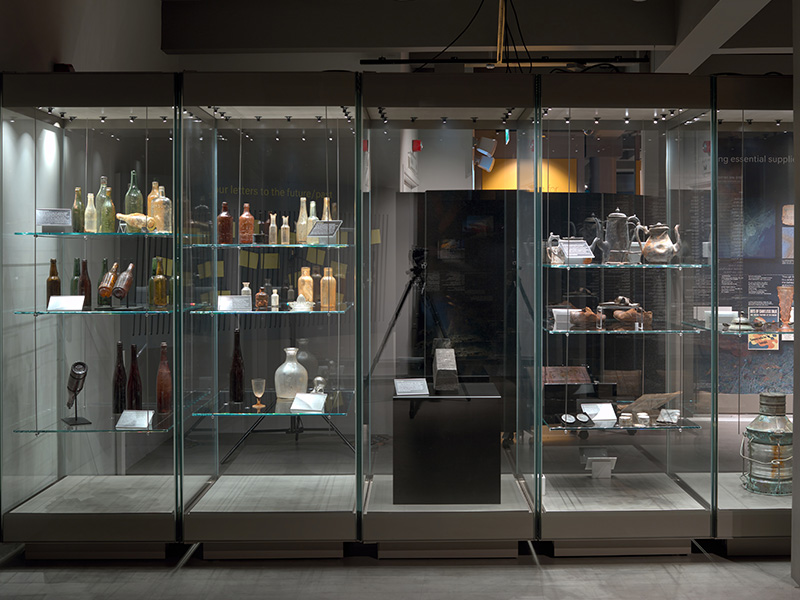 Museum objects in glass display cases.