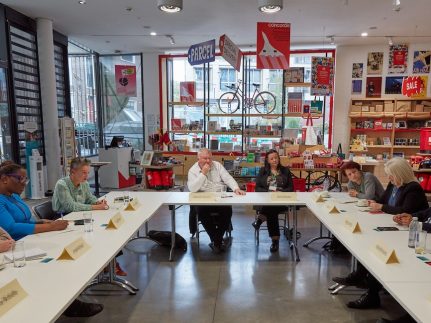 Members of the project seated at a roundtable discussion.