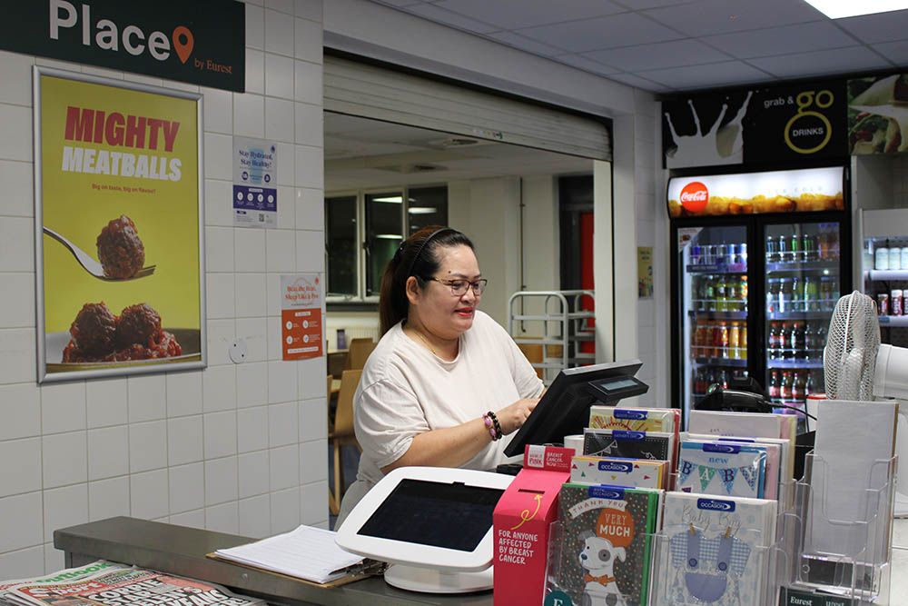 A woman at the counter in the canteen.