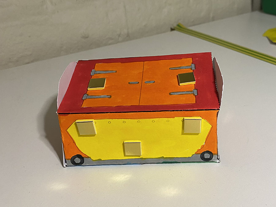 A colourful paper model of a Mail Rail York trolley.