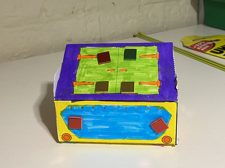 A colourful paper model of a Mail Rail York trolley.