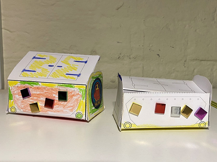 A colourful paper model of a Mail Rail York trolley.