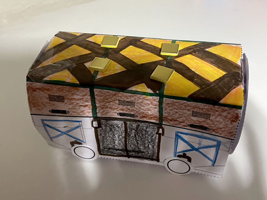 A colourful paper model of a Mail Rail train.